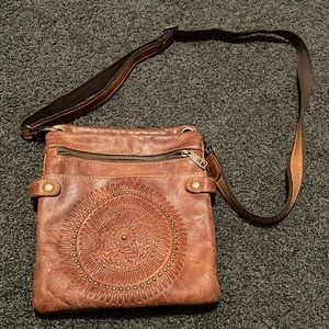 Patricia Nash adjustable crossbody purse with fleece lined pockets.
